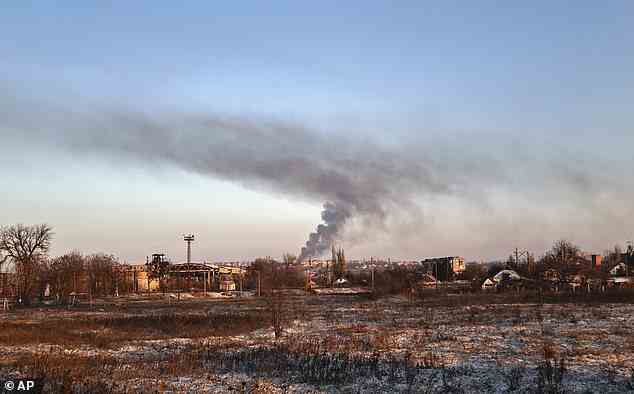 Smoke rises after shelling in Soledar, the site of heavy battles with Russian forces in the Donetsk region, Ukraine, Sunday, January 8, 2023