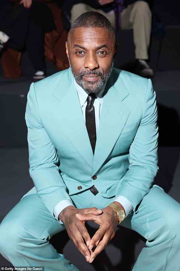 A look: Idris slipped his feet into a pair of black and navy blue Gucci loafer leather shoes which had a small tassel on the front.