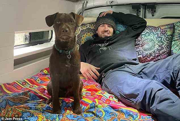 Despite not having constant access to home comforts like a bath, shower, or washing machine, the couple (Michael pictured with dog Buddy) enjoy their van living lifestyle