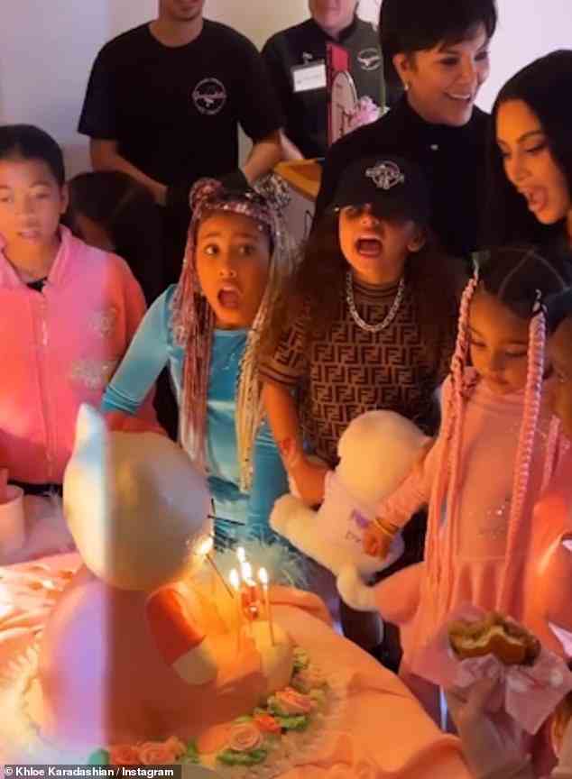 Family: She was surrounded by her friends and family including grandma Kris Jenner (right), her mum (far-right) and Tracy Romulus' daughter Remi, seven, a family friend (left)