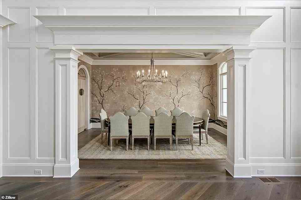 It comes with an 'exquisite formal dining room with custom hand-painted Gracie wallpaper,' per its listing