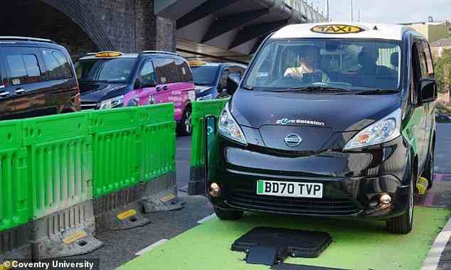 Specially-designed taxis in Nottingham need to drive over a charging pad embedded in the ground to get a burst of charge