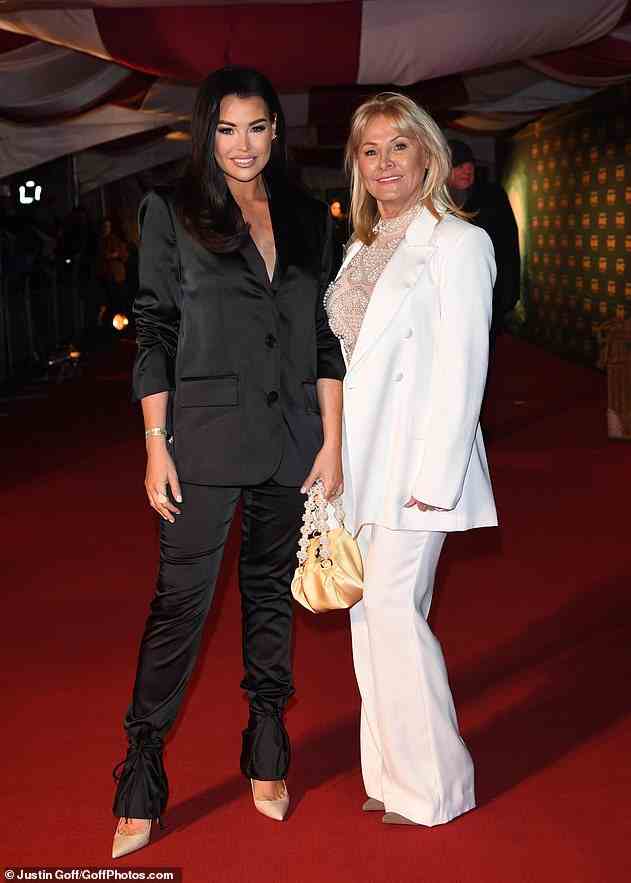 Stunners: Jess Wright looked sensational she turned up to the premiere in matching suits with her mum, Carol