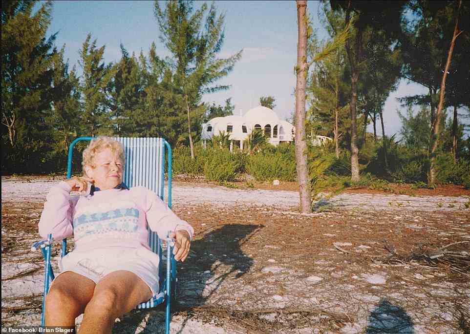 An undated photo of Bob Lee's wife, Margaret, enjoying  the sun in front of her iconic vacation home that has since been taken over by coastal erosion through rising sea levels. The original structure was built a quarter mile inland from the shoreline and now it sits 1,000 feet off the coast entirely submerged in the ocean water