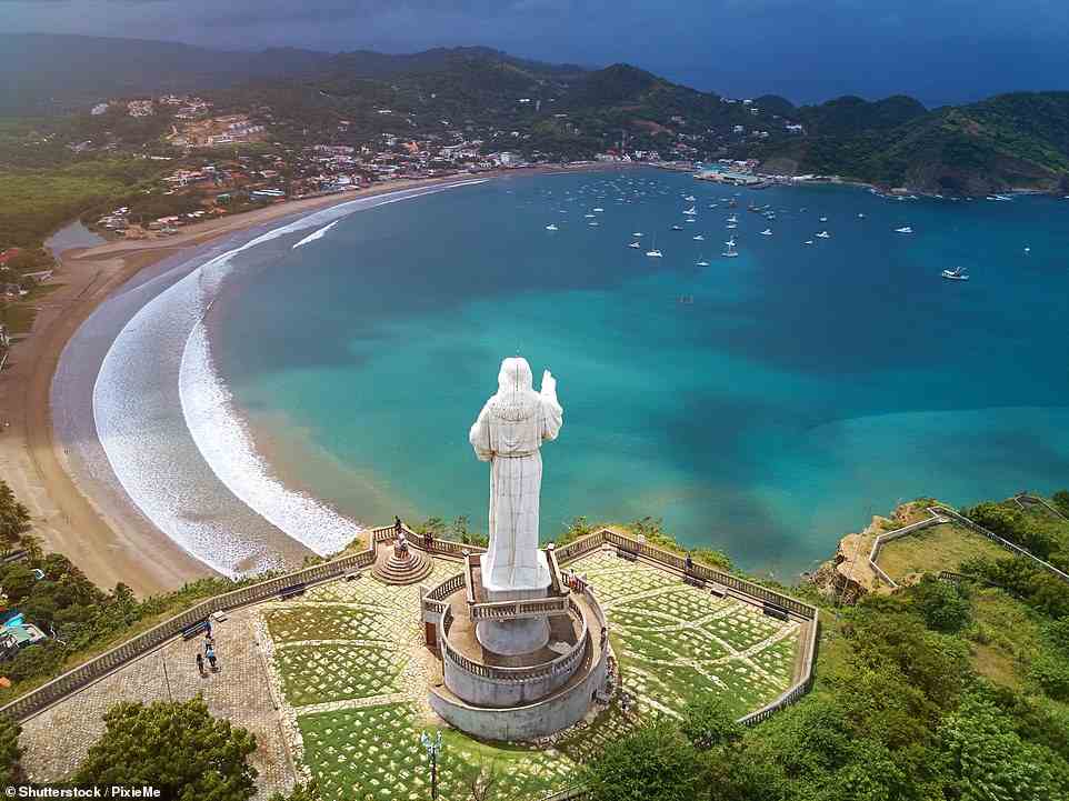 Charlotte settled in for brunch in San Juan del Sur (above), a bay that's overlooked by a huge statue of Christ