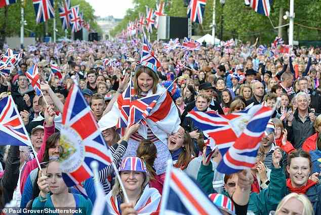 Prince Harry described the British public as being among 'the most credulous people in the world' as the fallout from his explosive new book continues. Pictured: Royal fans line the Mall near Buckingham Palace to mark the Queen's Diamond Jubilee in June 2012