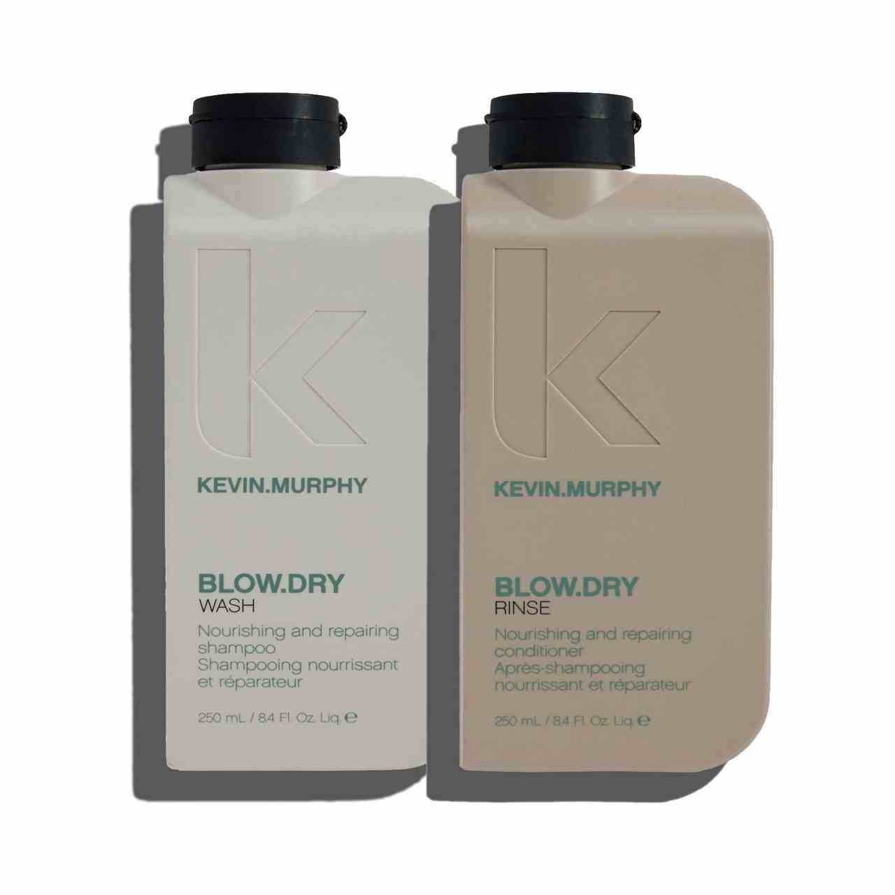 Kevin Murphy Blow.Dry Wash & Rinse graue und beige rechteckige Flaschen mit schwarzen Kappen auf weißem Hintergrund