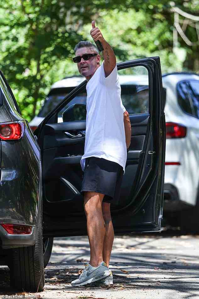Michael kept a low profile in dark sunglasses as he walked towards his car. He wore his salt and pepper locks styled for the outing, and was seen chewing gum