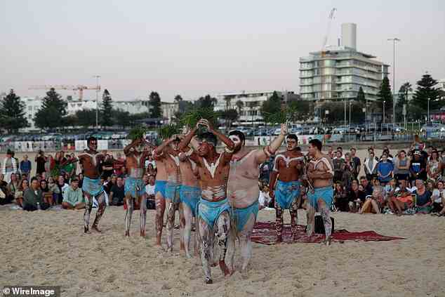 The 'Pay the Rent' campaign wants homeowners to voluntarily pay a percentage of their income to Aboriginal elders without any government oversight or intervention (pictured, Gamay Dancers at Bondi Beach)