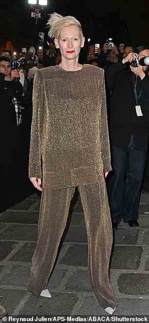 Gold: She put on a dazzling display in a gold co-ord set, made up of an oversized long-sleeved top and trousers