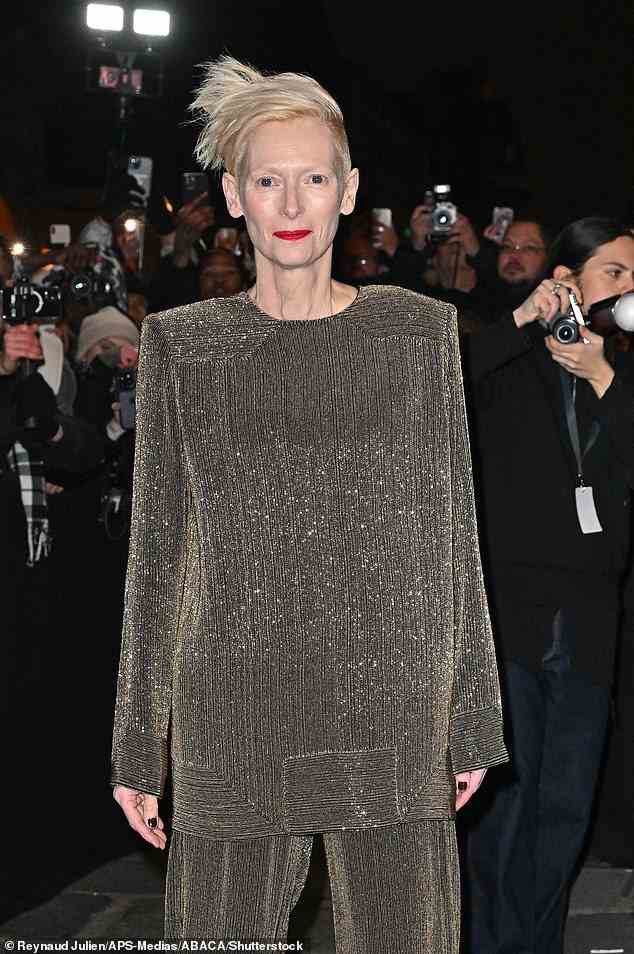 Bold look: Tilda's jumper featured padded shoulders as she cut a dazzling figure for the event