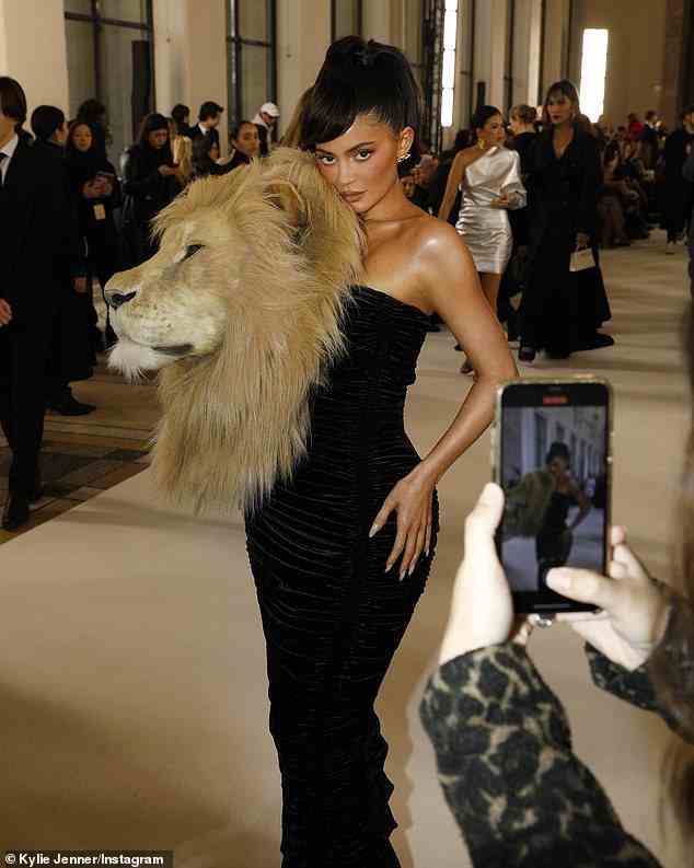 Quirky look: She debuted a stunning black dress which hugged her curves, but it was the enormous, realistic lion head attached to the front that got the most attention