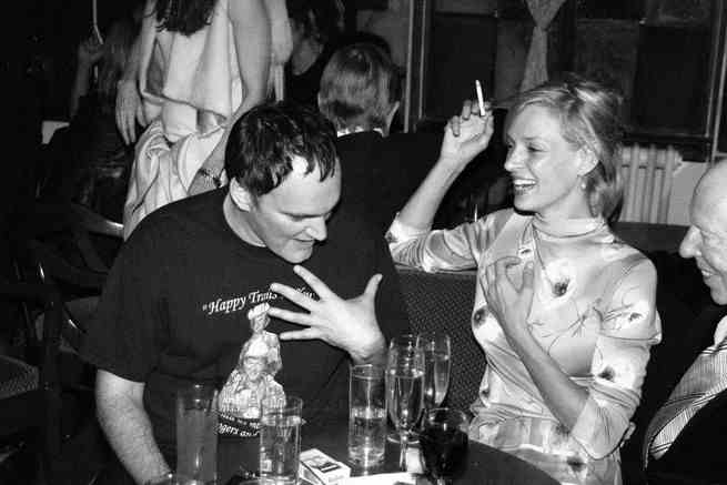 a black and white image of Quentin Tarantino and Uma Thurman at Chateau Marmont