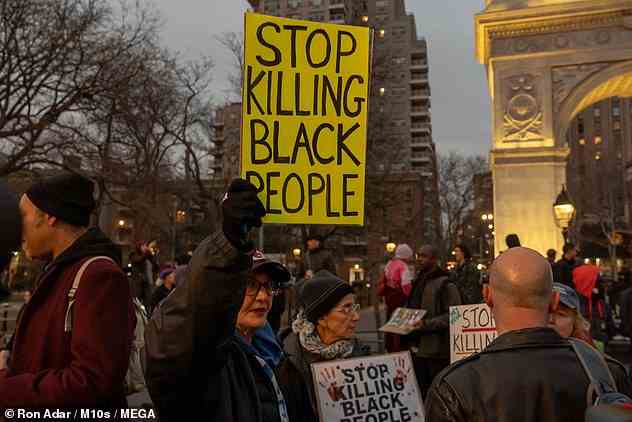 Protestors held signs calling for an end to the deaths of black people at the hands of police