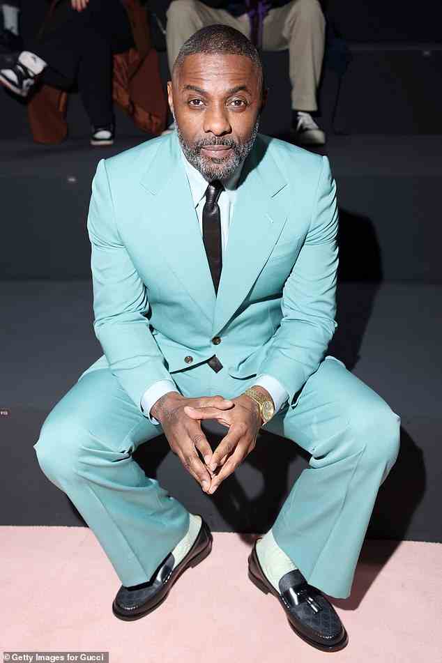Typically dapper: Idris Elba has arrived at the Gucci show at Milan Fashion week in his typically dapper style donning a bold turquoise suit