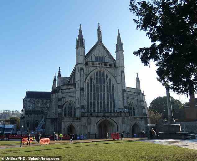 Filming: Crew members from The Crown were seen setting up Winchester Cathedral on Saturday as they prepared to film scene's for Princess Diana's funeral