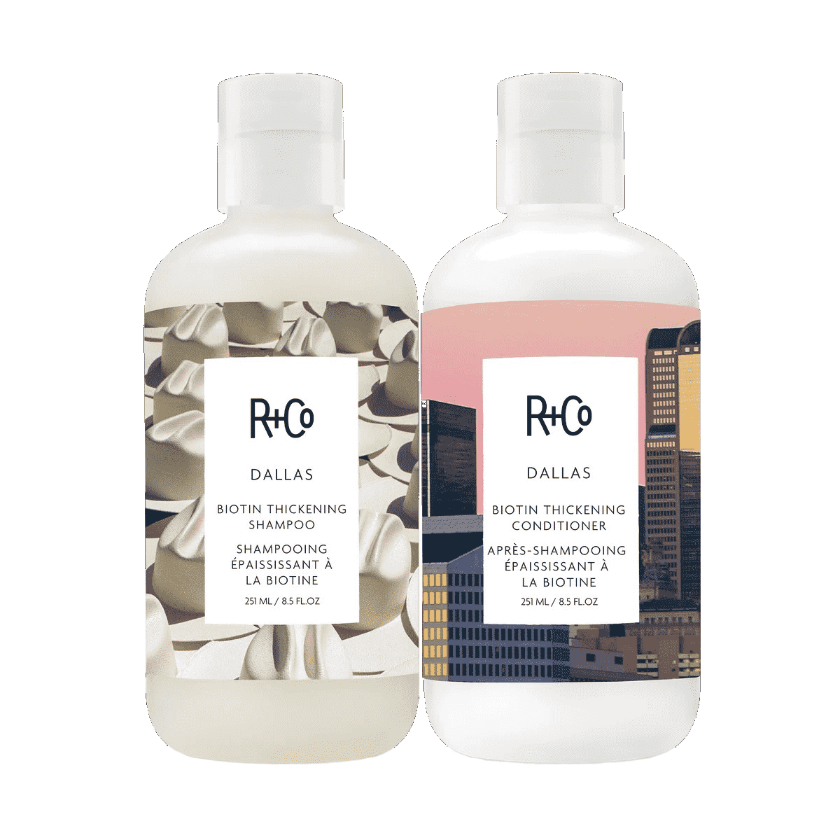 R+Co Dallas Thickening Shampoo + Conditioner zwei Flaschen mit Blüten- und Stadtbild-Designs auf weißem Hintergrund
