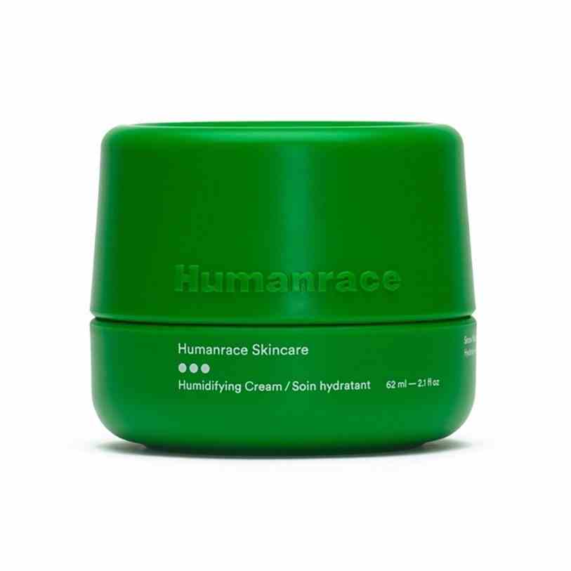 Humanrace Humidifying Face Cream grünes Glas auf weißem Hintergrund