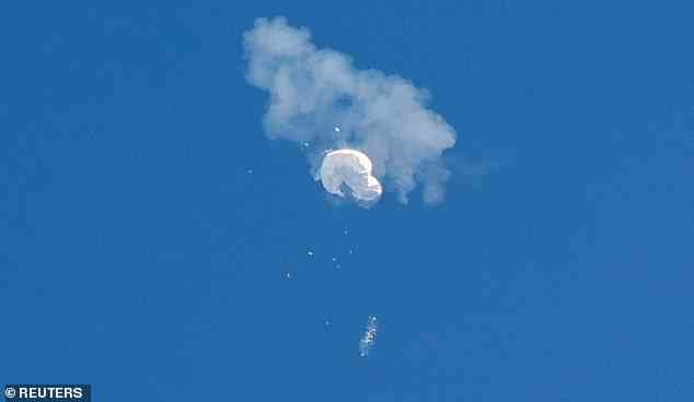 The suspected Chinese spy balloon drifts to the ocean after being shot down off the coast in Surfside Beach, South Carolina, February 4, 2023