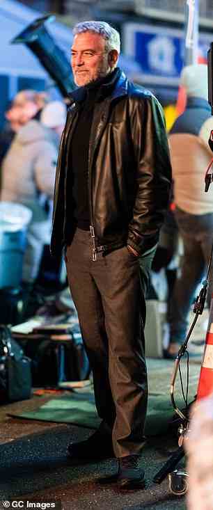 Good mood: Clooney looked to be in a fantastic mood on set, and was pictured smiling