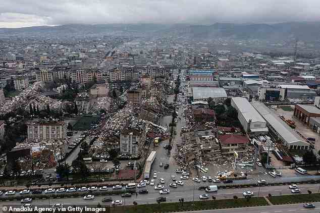 So far, more than 5,100 fatalities confirmed in Turkey and Syria, with scores more trapped in the ruins of their demolished homes. Pictured: The Turkish city of Hatay is seen after Monday morning's quake levelled buildings across the region