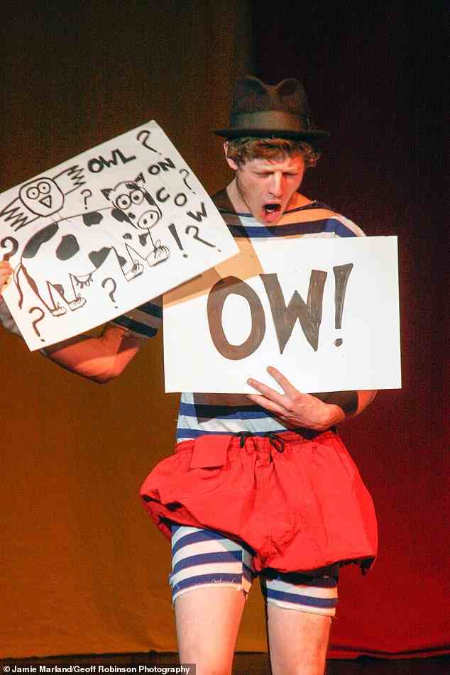 Wow: Wearing a black trilby hat and carrying signs with drawings and words on them, Norton was just 21 when the Footlights show was staged back in 2006