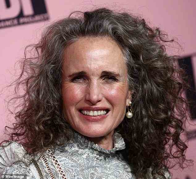 Andie MacDowell, 64, has been embracing her grey hair since 2021, and said she's never felt more powerful (pictured in October 2021)