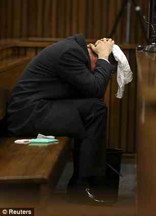 Pistorius covers his head with a handkerchief