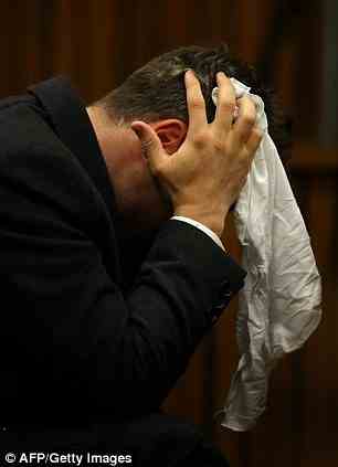 Oscar Pistorius reacts in the dock during his murder trial