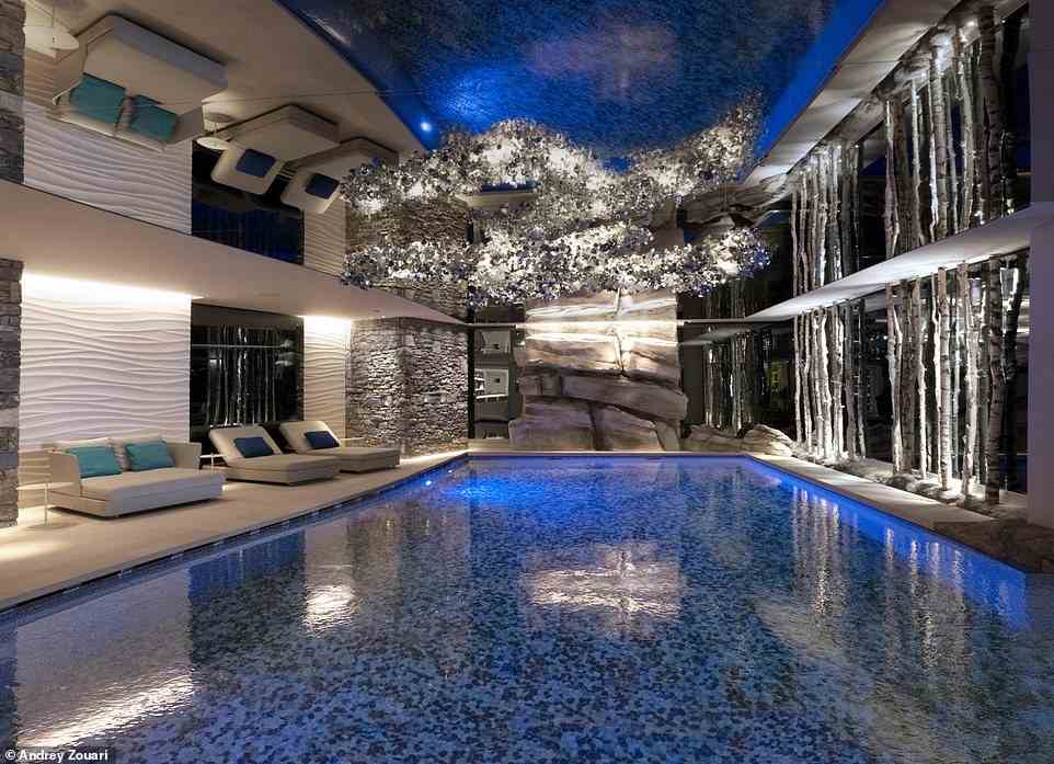 There's 'an eye-catching swimming pool worthy of a Bond villain lair, with striking blue tiles, stone walls, and a mirrored ceiling'