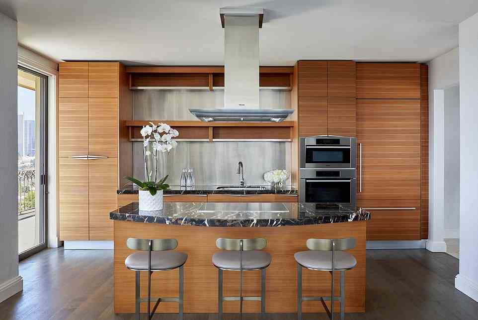A state-of-the-art kitchen with a serving island and marble countertops 'makes catering a breeze'