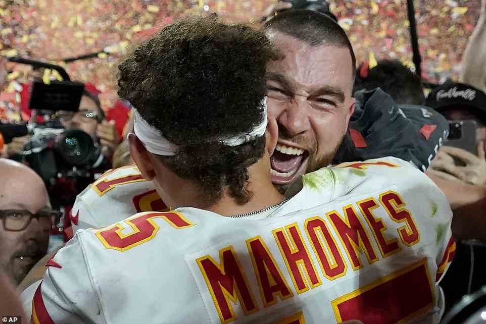 Mahomes and teammate Travis Kelce embrace after winning Super Bowl LVII by beating the Eagles on Sunday night