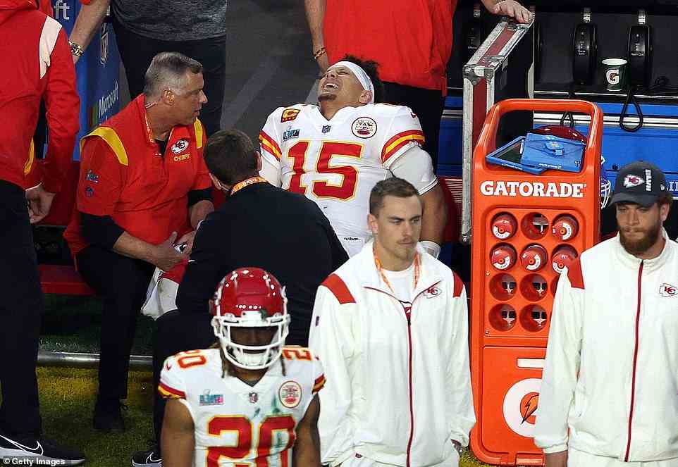 Kansas City Chiefs quarterback Patrick Mahomes grimaces in pain after limping off with his troublesome ankle injury