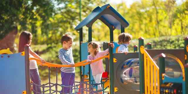 If you are age 14 or over, you may not play on a playground in Kansas. Parents and caregivers are excluded from this rule, according to Kansas law.