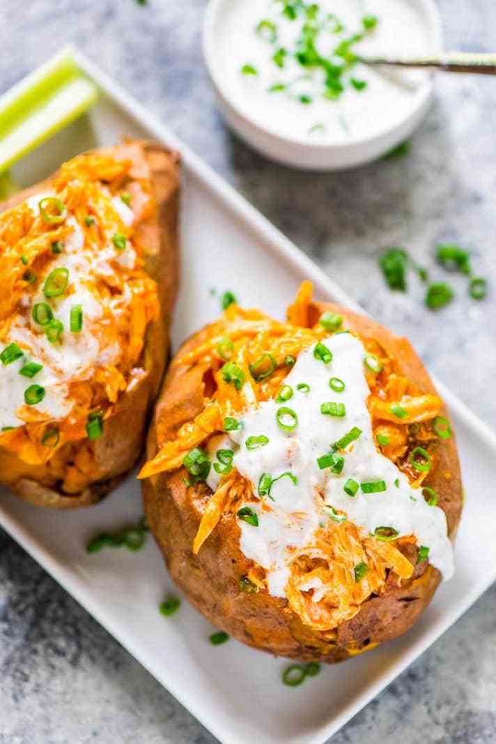 STYLECASTER | 17 Superbowl Snacks You Can Make In a Slow-Cooker | Buffalo Chicken-Stuffed Sweet Potatoes