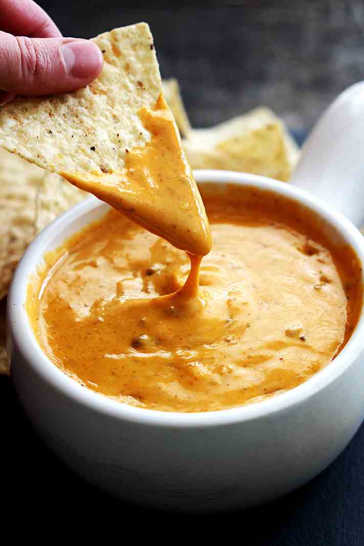 STYLECASTER | 17 Superbowl Snacks You Can Make In a Slow-Cooker | Copycat Chili's Queso