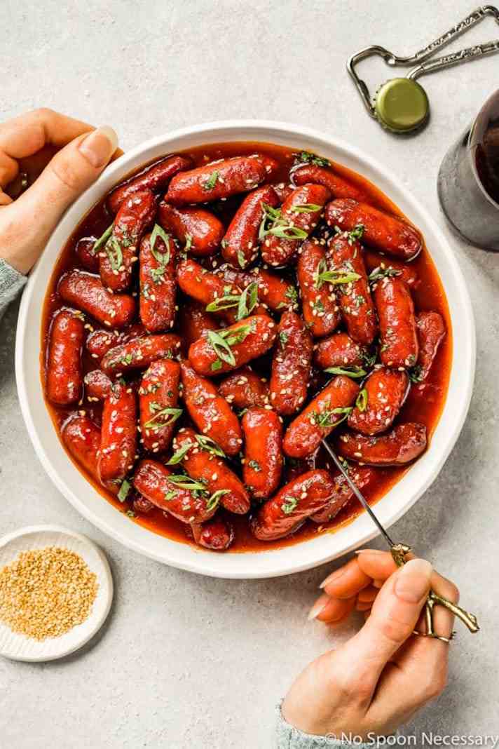 STYLECASTER | 17 Superbowl Snacks You Can Make In a Slow-Cooker | Honey-Sriracha Little Smokies