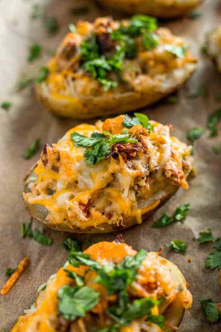 STYLECASTER | 17 Superbowl Snacks You Can Make In a Slow-Cooker | Carnitas-Loaded Potato Skins