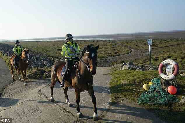 Mounted police in Knott End-on-Sea are pictured yesterday as they take part in the search for missing Nicola Bulley