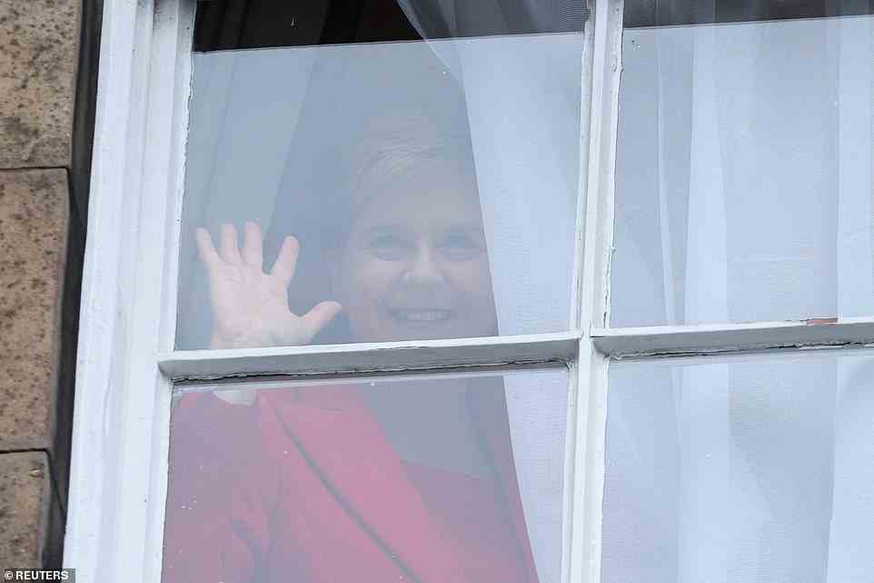 Ms Sturgeon waved to the crowd outside Bute House after making her dramatic announcement