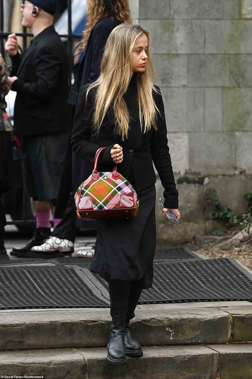 Lady Amelia Windsor carries a Westwood bag as she attends a memorial for the late designer