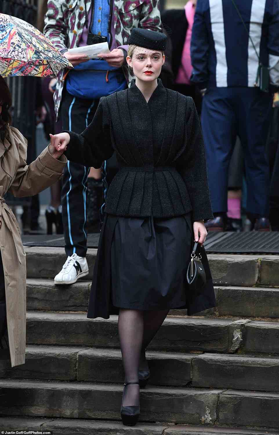 Actress Elle Fanning wore an all-black ensemble with a matching pillar-box hat