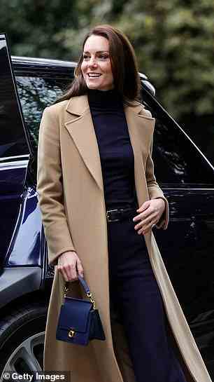 The royal mother-of-three paired her trendy navy ensemble with a camel coat which she has worn on previous occasions