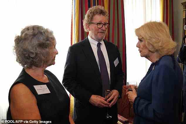 Camilla is pictured here speaking with British authors Sebastian Faulks and Philippa Gregory at Clarence House