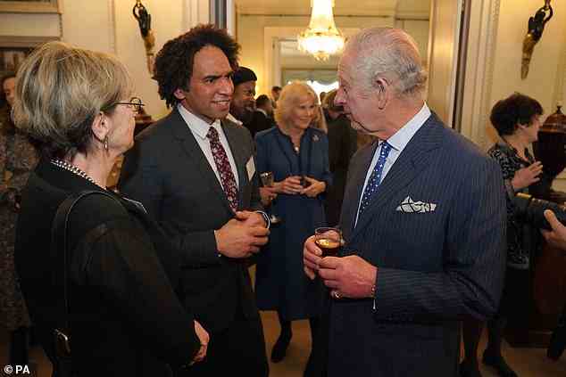 King Charles III is pictured here chatting with Joseph Coelho at his wife's Reading Room event on Thursday