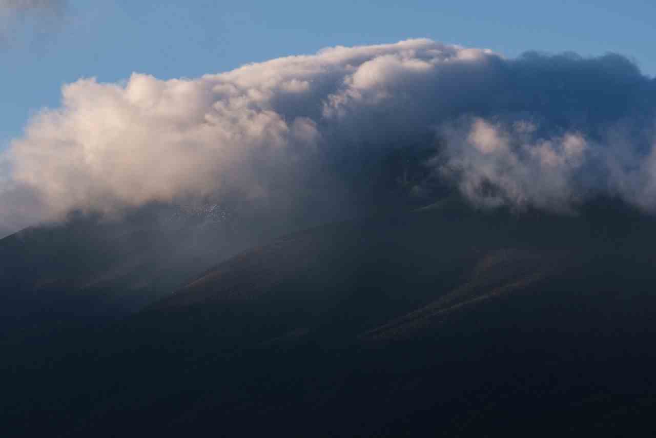 Late afternoon clouds shroud the peak of Mount Asama. Karuizawa is on the southern slopes of this volcano.
