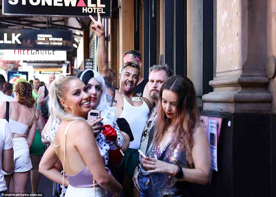 Parade goers gathered outside the Stonewall hotel, one of Sydney's top LGBTQ+ venues. It is named for New York's 1969 Stonewall rebellion which marked the start of today's Pride marches