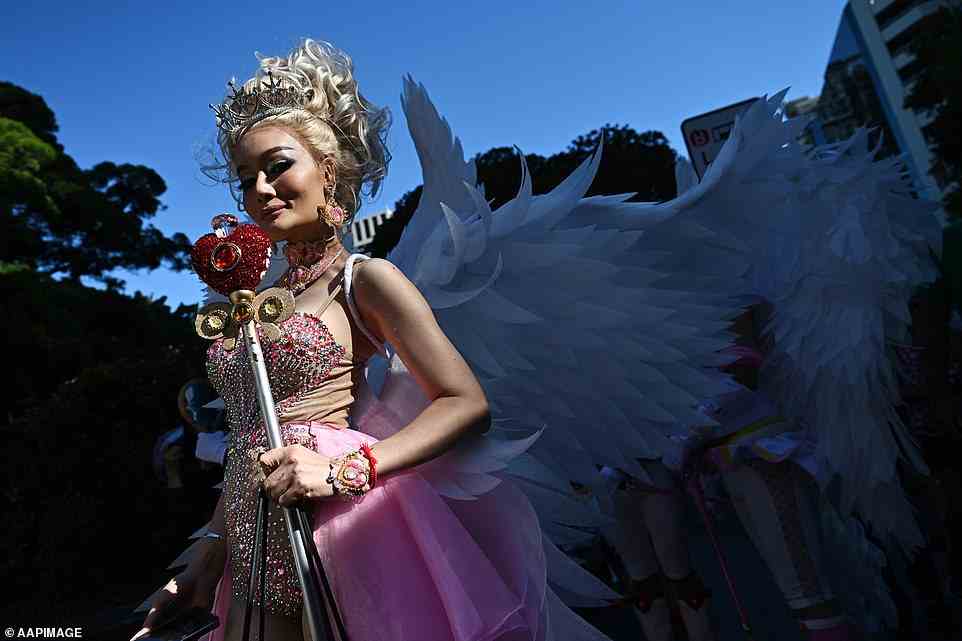 More than 200 floats and 12,500 parade participants will dance through 1.7 kilometres of rainbow-lined streets in a celebration of queer identity, community and equality. One performer is seen