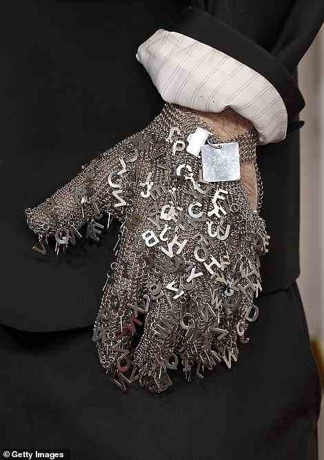 The chainmail glove was covered in metal letters - and Jordan added a creepy contact lens to complete the bizarre look