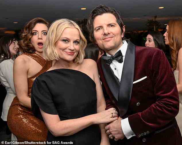 Hilarious: Afterwards, Amy and Adam posed together for a snap, which Aubrey hilariously photobombed in the background